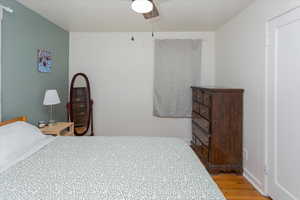 Bedroom featuring light wood finished floors and a ceiling fan