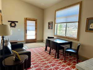 Interior space with light carpet and baseboards