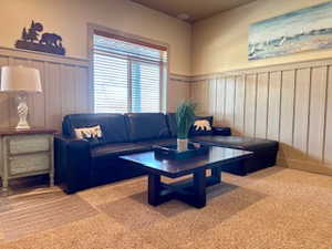 Game room family room featuring a decorative wall and wainscoting
