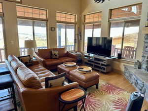 Living room featuring bamboo wood finished floors, view out every window