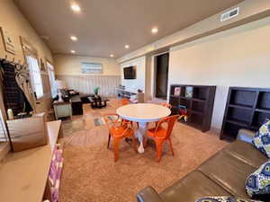Interior space featuring recessed lighting and visible vents