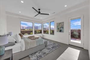 Bedroom with access to exterior, a ceiling fan, recessed lighting, and a mountain view
