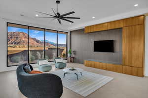 Living area featuring a ceiling fan and recessed lighting