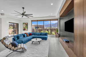 Living area featuring recessed lighting and a ceiling fan