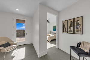 Sitting room with recessed lighting and ceiling fan