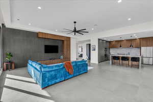 Living room with recessed lighting, ceiling fan, and light tile patterned floors