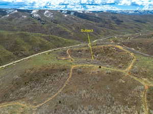 Bird's eye view of a mountain backdrop and property location
