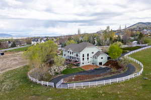 Birds eye view of property with a mountain view