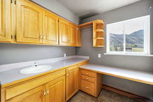 Interior space featuring a mountain view and a sink