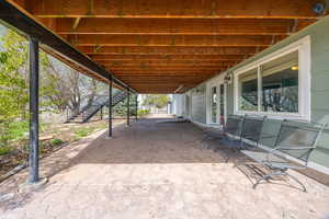 View of patio with stairs and french doors