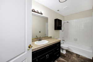 Full bathroom featuring visible vents, toilet, tub / shower combination, and vanity