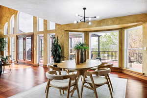 Dining area featuring an inviting chandelier and wood finished floors