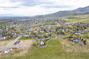 Birds eye view of property with a mountain view and a residential view