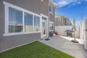 View of patio / terrace with a grill and fence