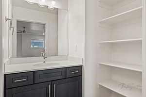 Bathroom featuring a ceiling fan and vanity