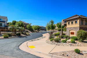 View of road featuring a residential view, sidewalks, and curbs