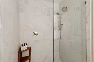 Bathroom featuring a tile shower