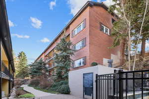 View of building exterior featuring fence