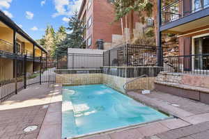 View of swimming pool with fence