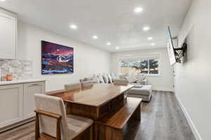 Dining area with baseboards, recessed lighting, and wood finished floors