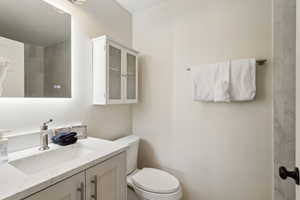 Bathroom with toilet and vanity
