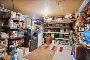 Storage area featuring independent washer and dryer