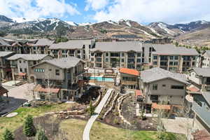 Birds eye view of property featuring a mountain view and a residential view