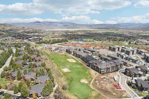 Drone / aerial view with a mountain view and view of golf course