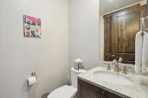 Half bath with toilet and vanity