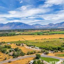 Birds eye view of property with a mountain view and a rural view