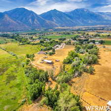 Aerial view featuring a rural view and a mountain view