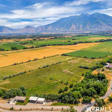 Birds eye view of property featuring a rural view and a mountain view