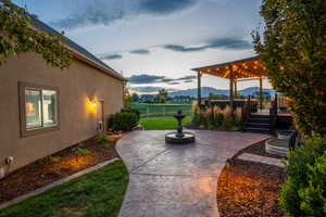 View of patio featuring fence and a deck with mountain view