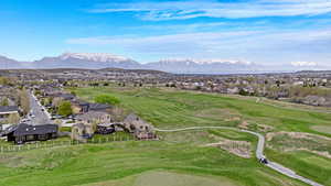 Bird's eye view with a mountain view, a residential view, and view of golf course