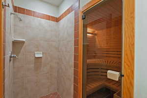 Bathroom on the lower level with walk in shower and sauna