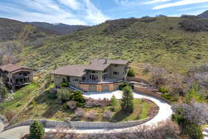 Birds eye view of property with a mountain view