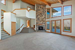 Living room with stairs leading to bedroom areas