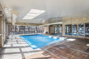 Clubhouse pool featuring french doors and a patio. Can be reserved for a special occasion.