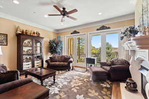 Living area featuring ceiling fan, crown molding, and recessed lighting & panoramic view