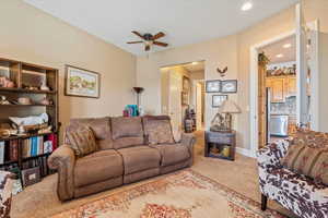 Family room featuring baseboards, recessed lighting, a ceiling fan, and carpet
