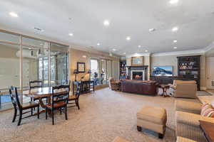 Clubhouse living area with a wealth of natural light, crown molding, and recessed lighting. Can be rreserved for special occasions.