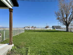 View of yard featuring fence