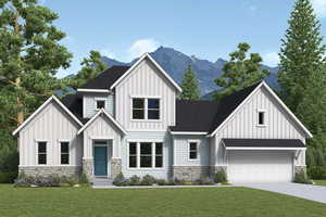 View of front of home featuring concrete driveway, board and batten siding, stone siding, a mountain view, and a front lawn