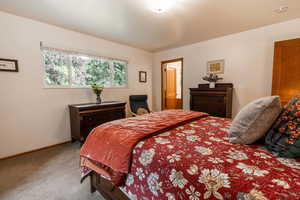 Carpeted bedroom with baseboards