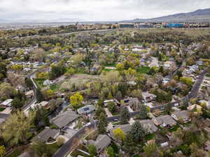 Birds eye view of property with a mountain view and a residential view