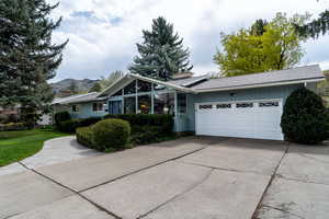 Single story home with a garage and driveway