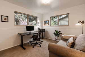 Carpeted office with wainscoting