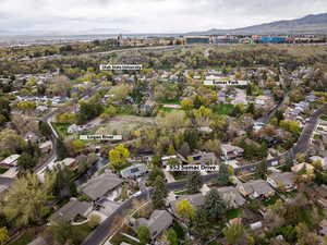 Birds eye view of property with a mountain view and a residential view