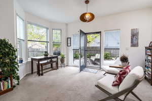 Living area with light carpet