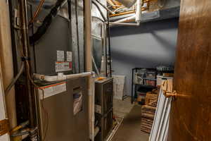 Utility room featuring heating unit